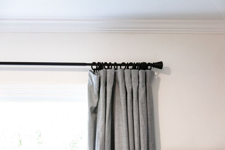 A close-up view of curtains with drapery rings