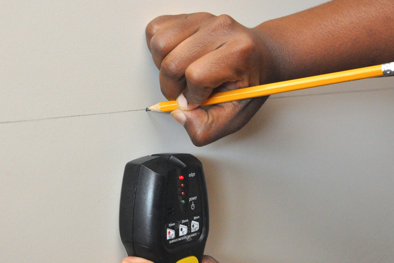 Stud finder in use.