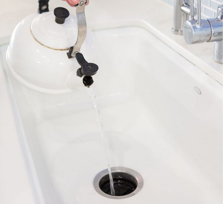 Pour hot water down the drain