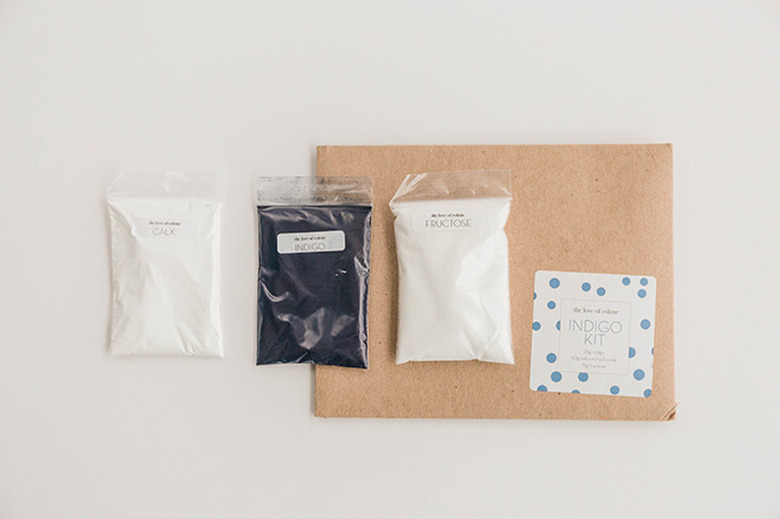 Combine the dye ingredients in a bucket of water.