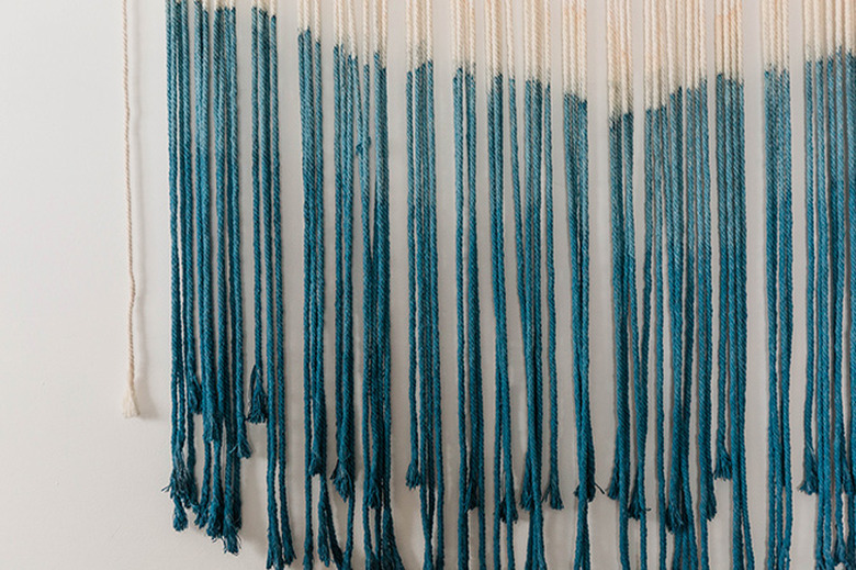 Re-dip the macrame into the bucket of dye to achieve an ombre effect.