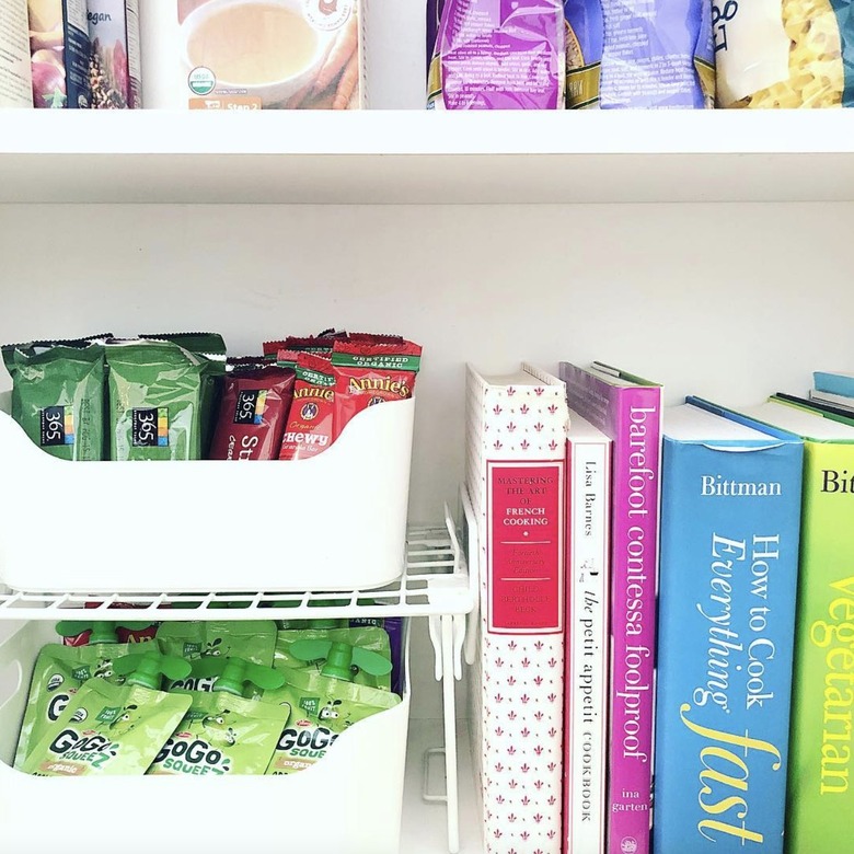 Pantry with snack bins and cookbooks