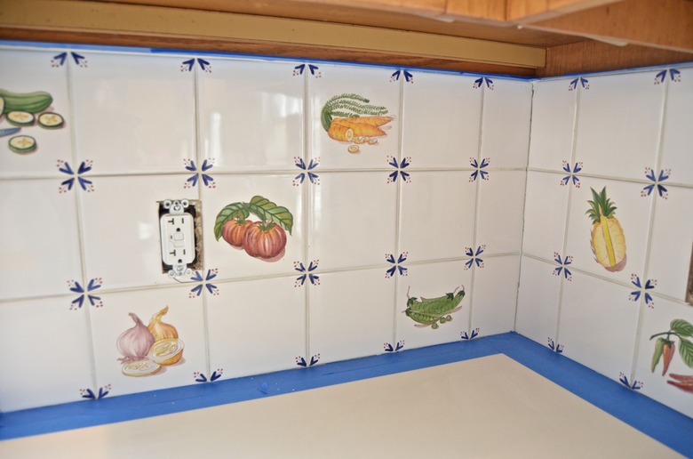 tape off countertop and cabinet