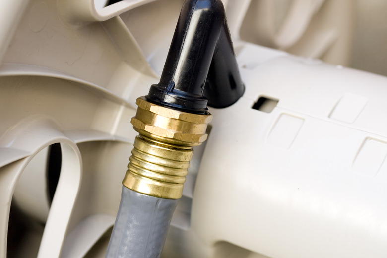 Hose attached to water coupling.