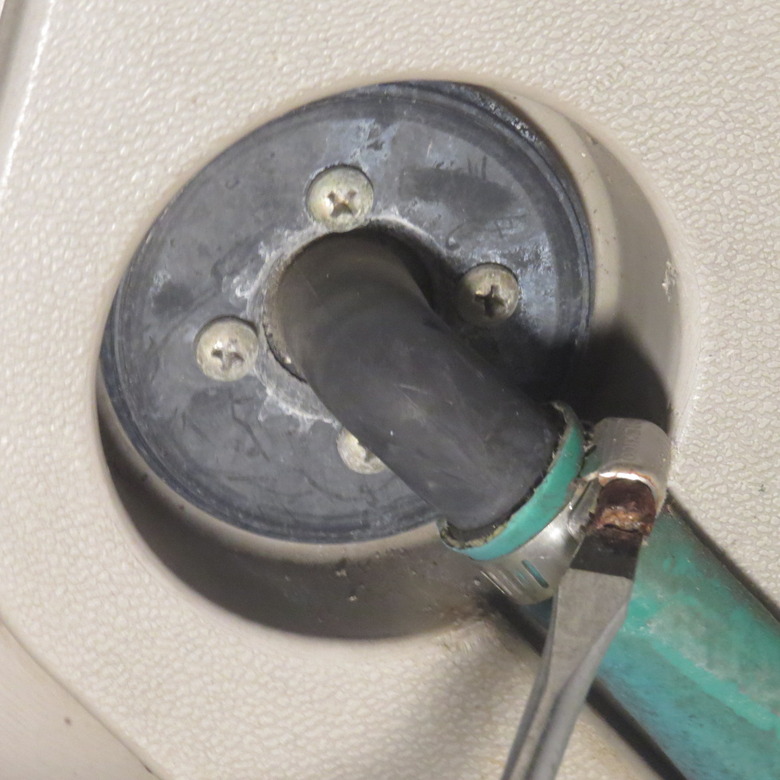 Hose clamp attaching hose to reel.