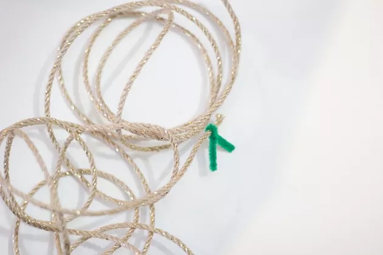 Skinny burlap ribbon tied with green pipe cleaner