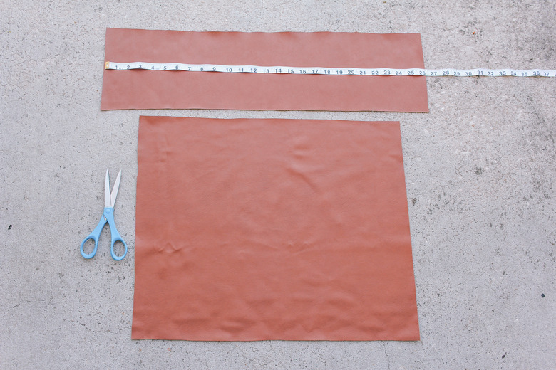 Faux leather fabric pieces cut out for chair back and seat