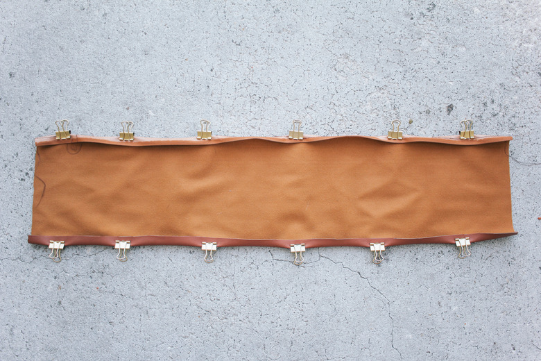 Top and bottom seams of chair back folded and clipped in place