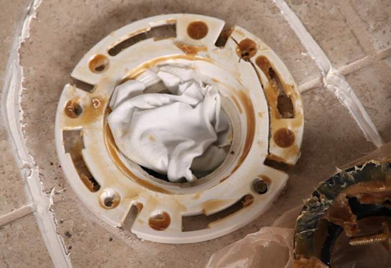 Toilet flange blocked with a rag.