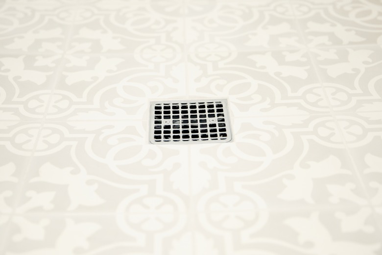 tan patterned shower floor tile