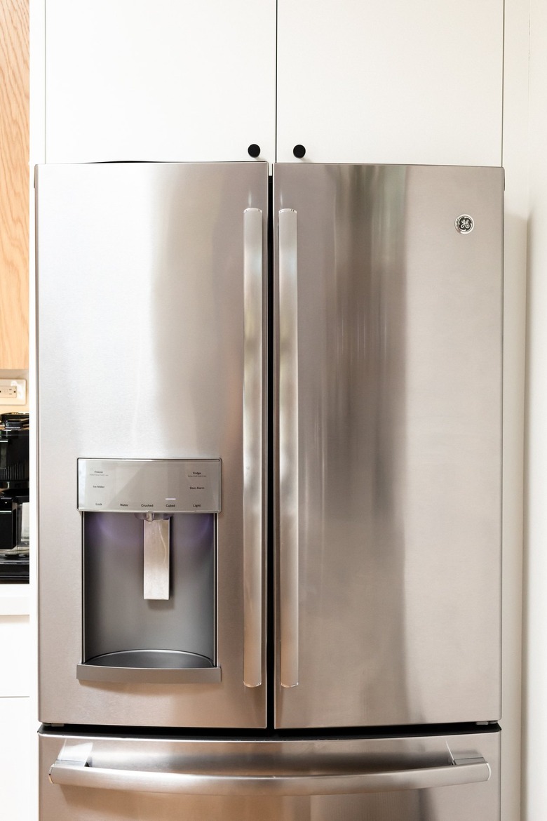 A stainless steel refrigerator with an ice maker