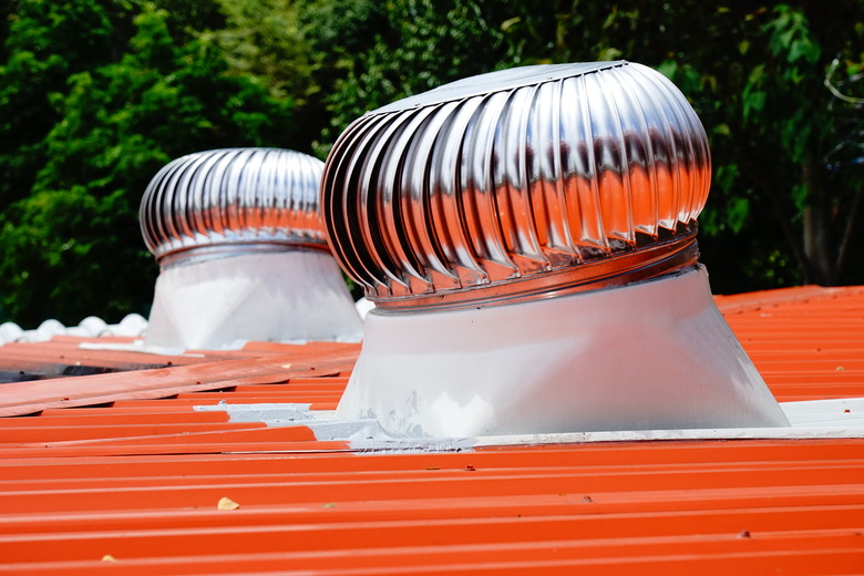 Air ventilators on the roof top spinning