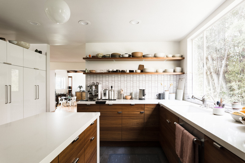 large kitchen with window looking toward trees