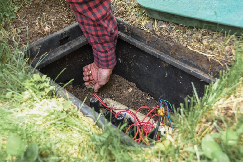 closing sprinkler system drain valve in valve box