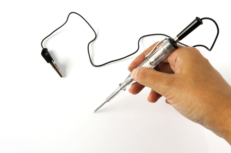 Screwdriver mains tester on a white background.