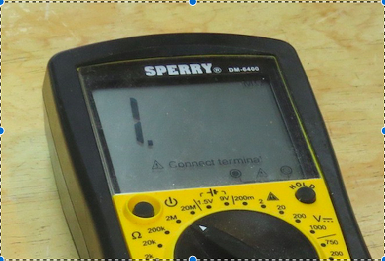 An ohm meter with a resistance reading of 1.