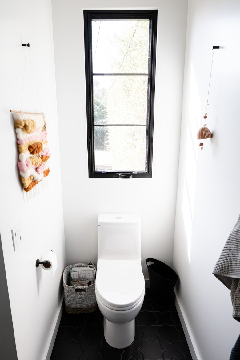 small bathroom with toilet and window
