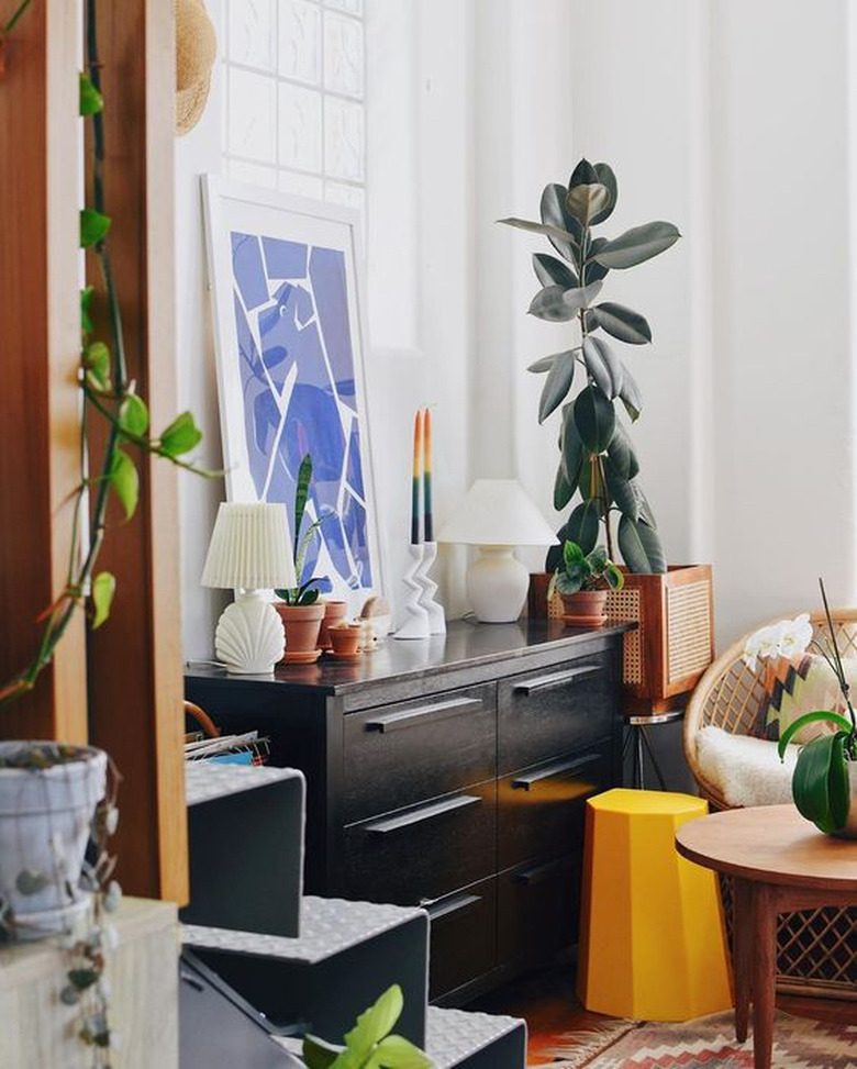 Mr. Cigar Loft sideboard with framed artwork