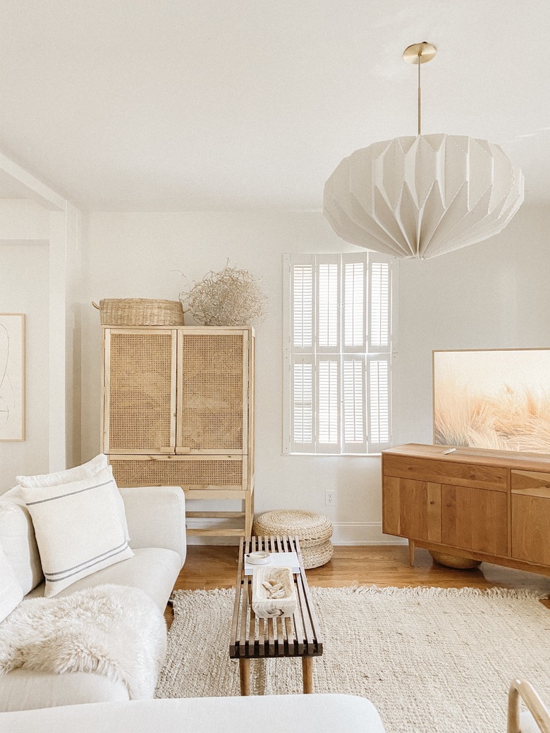 Sylvia Tribel living room with cane cabinet and pendant light