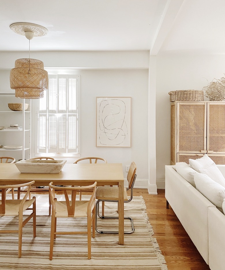 Sylvia Tribel home dining room with Wishbone chairs and IKEA pendant