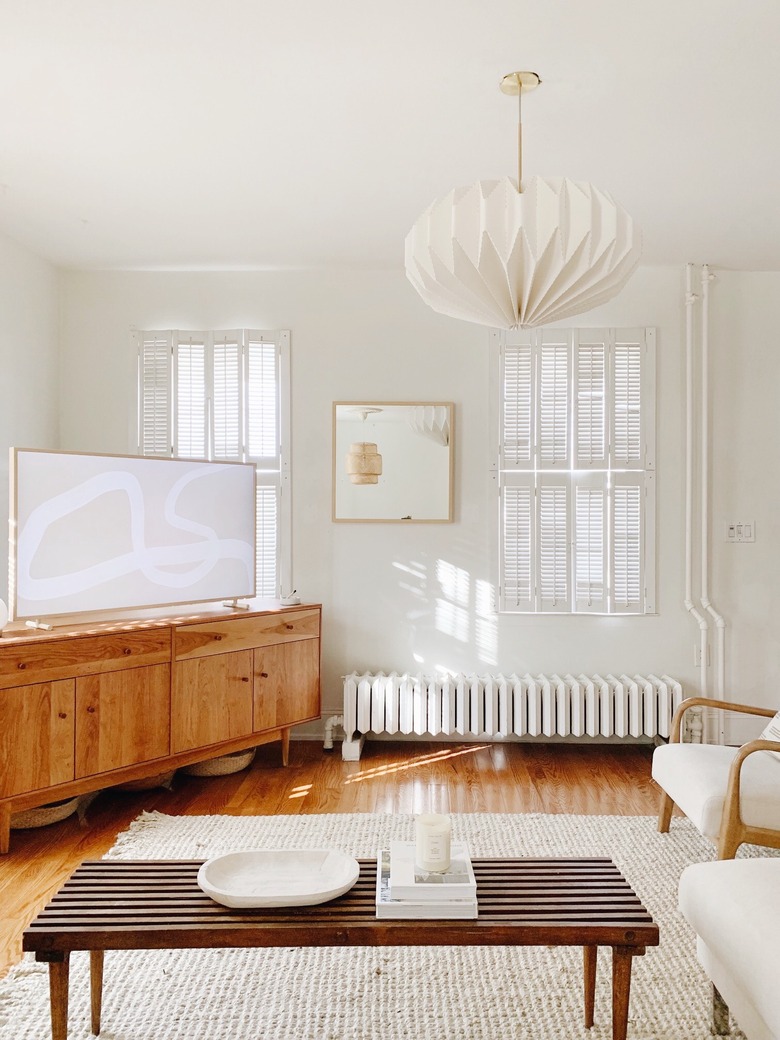 Sylvia Tribel living room with pendant light and area rug