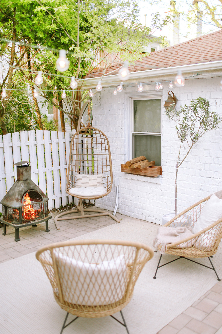 Sylvia Tribel backyard seating area with string lights