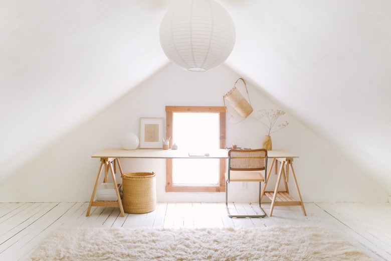 Sylvia Tribel attic with paper pendant and plywood desk