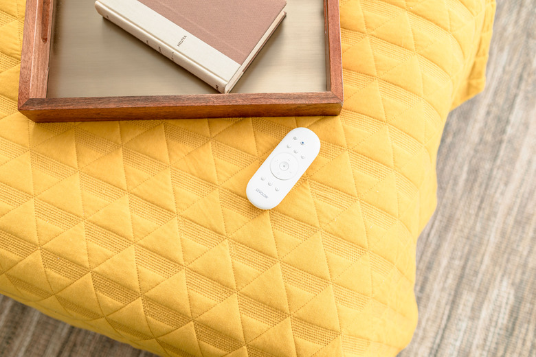 Overhead of bed with tray and remote