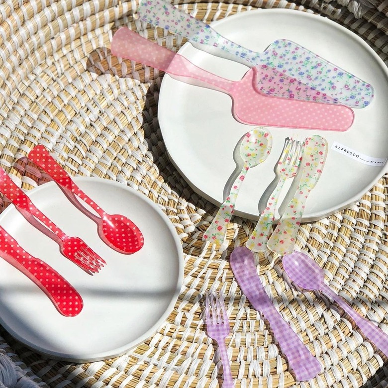 overhead photo of dishes and utensils in various colors