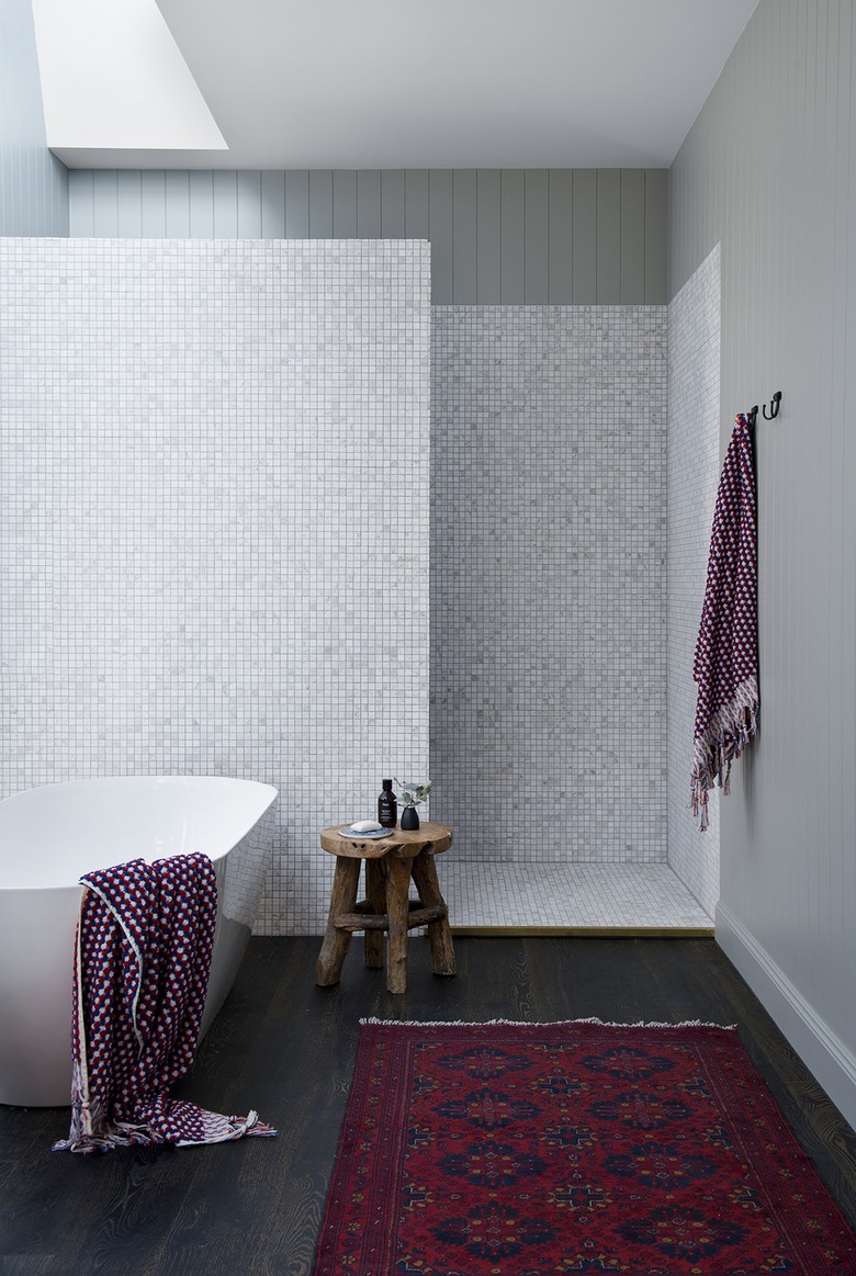 walk-in shower with marble tile mosaic