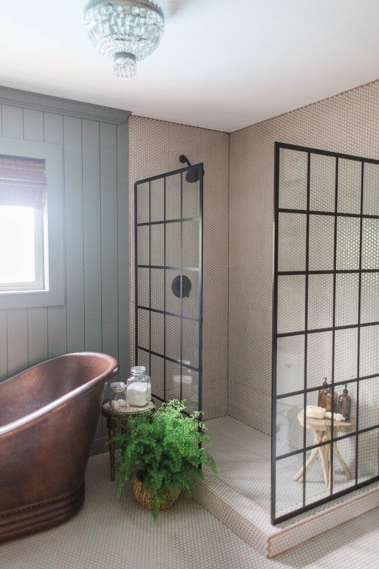 Rustic bathroom with copper tub and walk-in shower