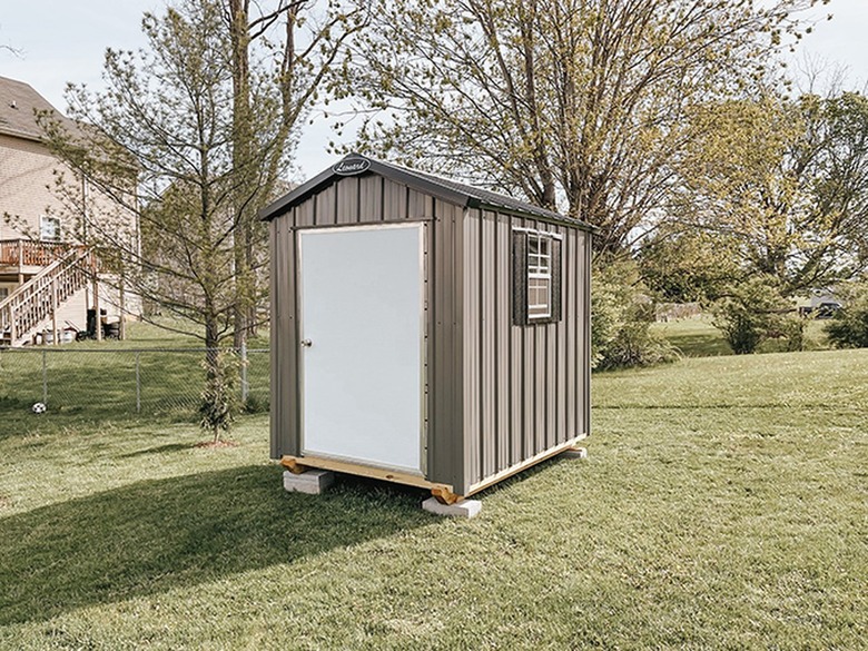 A plain storage shed with no stoop or platform.