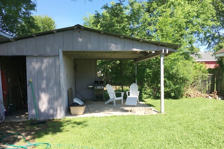 Patio before and after with a black slatted privacy screen and painted floor