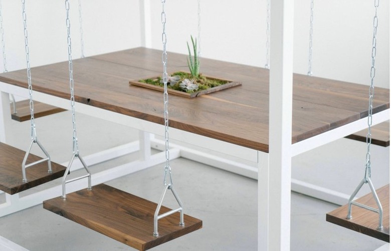 wood swing chairs around a swing table