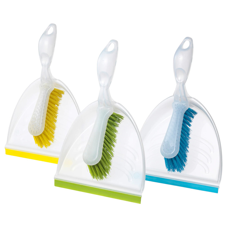 three dust pans and brushes in yellow