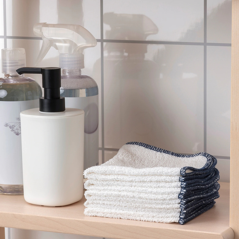 tiled area with soap and dish cloths