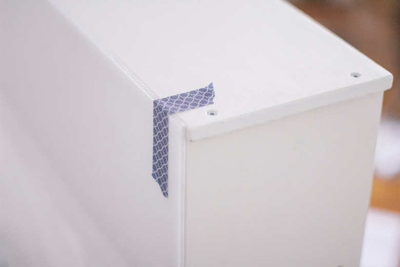 Poster board glued and tape to kitchen