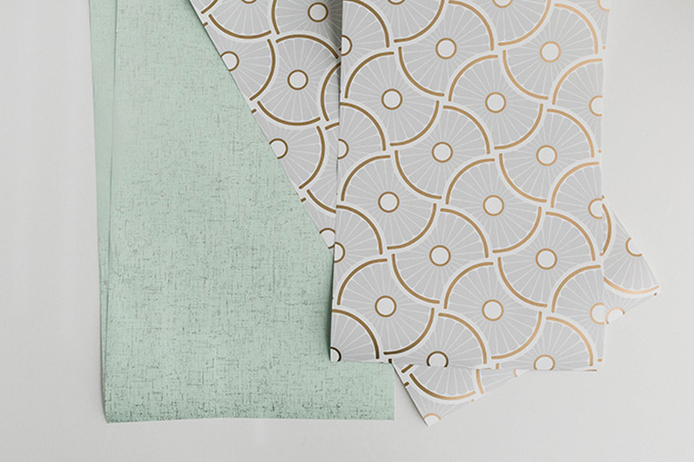 Cut the wallpaper pieces to size.