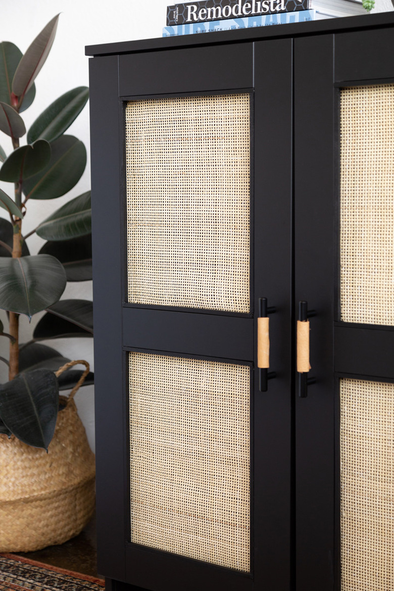 Black and cane IKEA cabinet