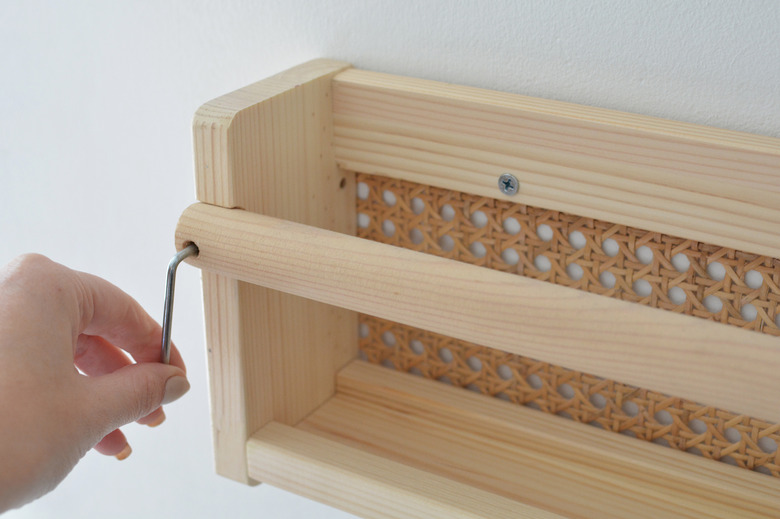 Screwing cane shelf to wall