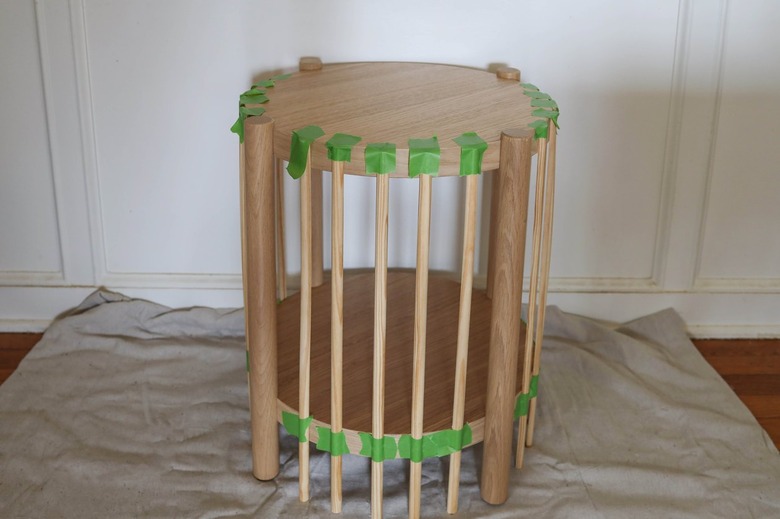 Painter's tape holding fluted pieces in place while glue dries