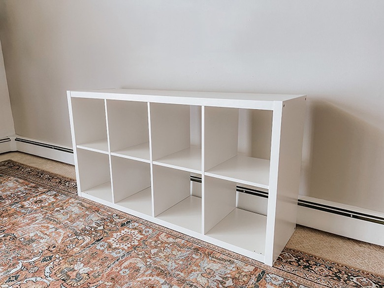 Assemble the IKEA Kallax shelf.