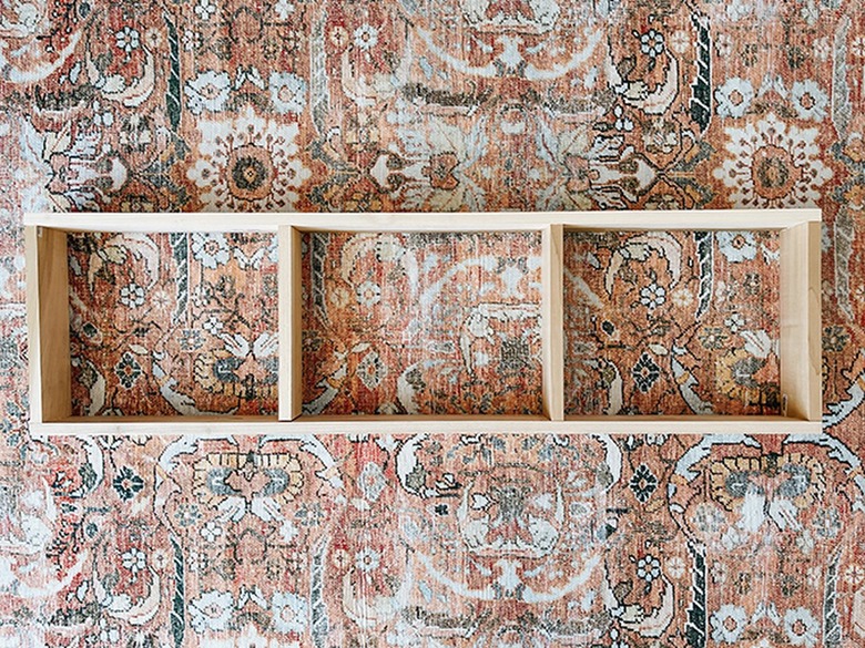 Assemble the wood pieces to form a wooden base.