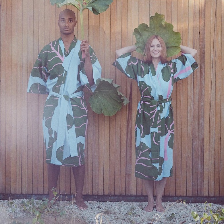 Two people wearing IKEA's new kimono featuring a pink