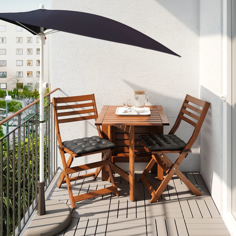 balcony with table and umbrella