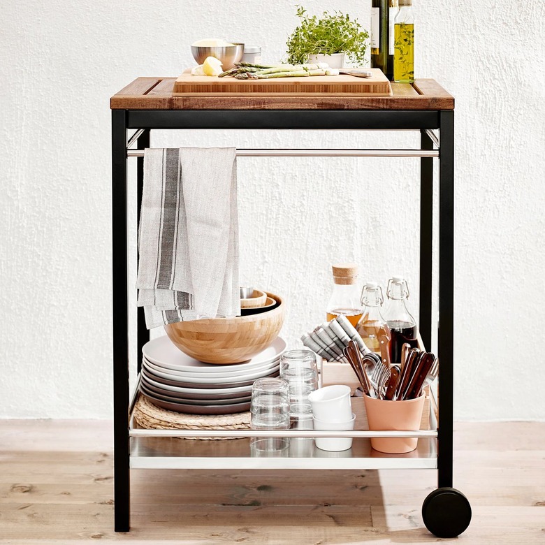 serving cart with wheel and various dishes