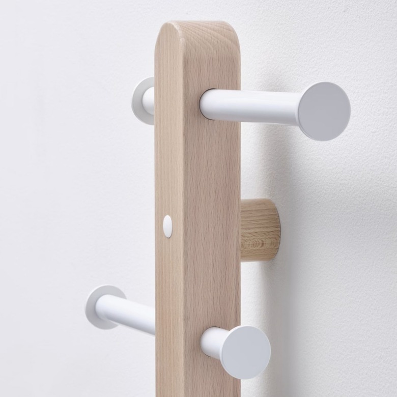 wood rack with white hooks