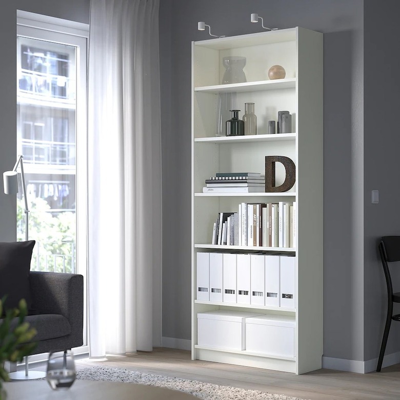 The IKEA Billy Bookcase in white filled with books