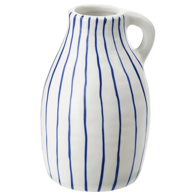 white and blue striped vase with handle