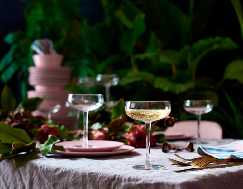table with plates and champagne coupes
